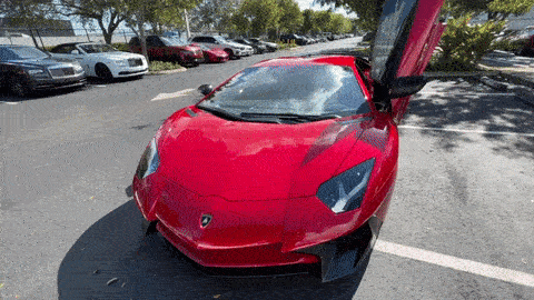 Red Lamborghini Aventador SV rental Miami gif mph club