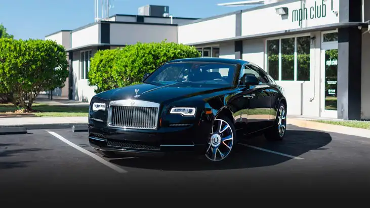 Black on black Rolls Royce Wraith rental Miami profile view - mph club