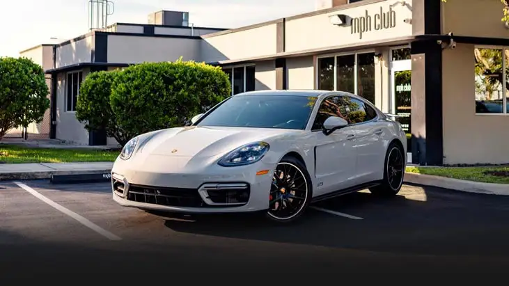 Grey Porsche Panamera GTS rental Miami profile view - mph club