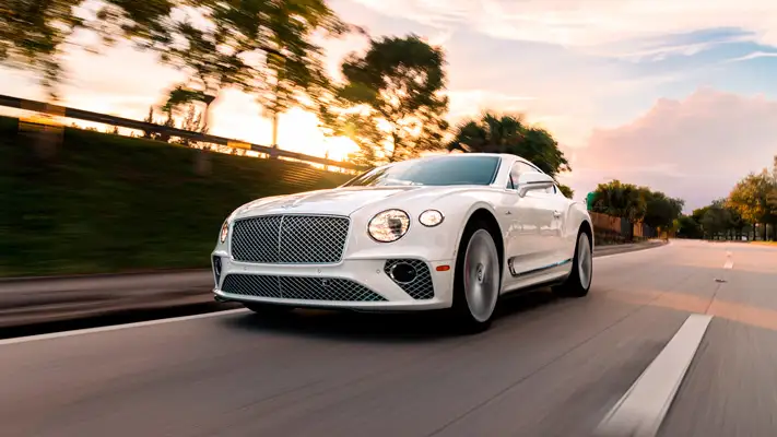 White on red Bentley GT rental Miami rolling view mph club