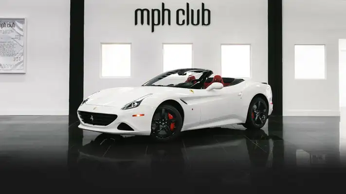 White on red Ferrari California T rental profile view - mph club