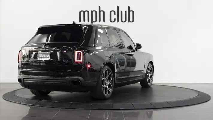 Black on black Rolls Royce Cullinan Black Badge rental rear view mph club