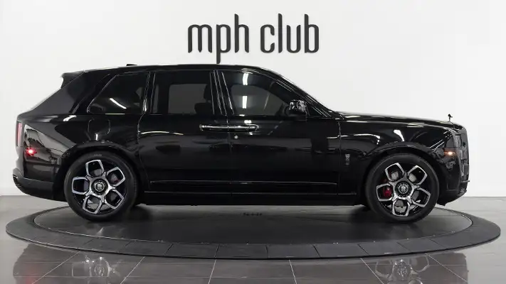 Black on black Rolls Royce Cullinan Black Badge rental side view mph club