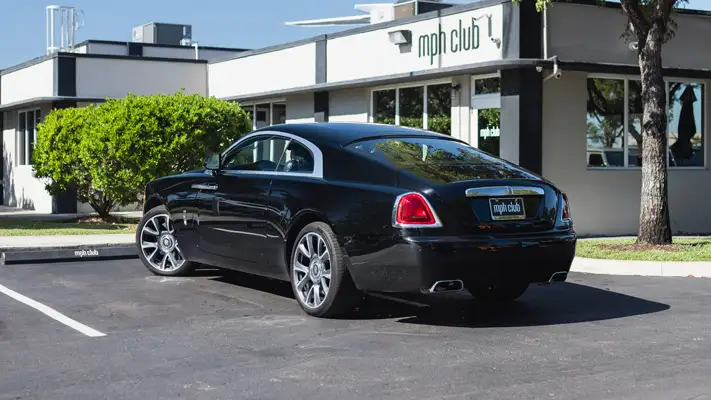 Black on black Rolls Royce Wraith rental Miami rear view mph club