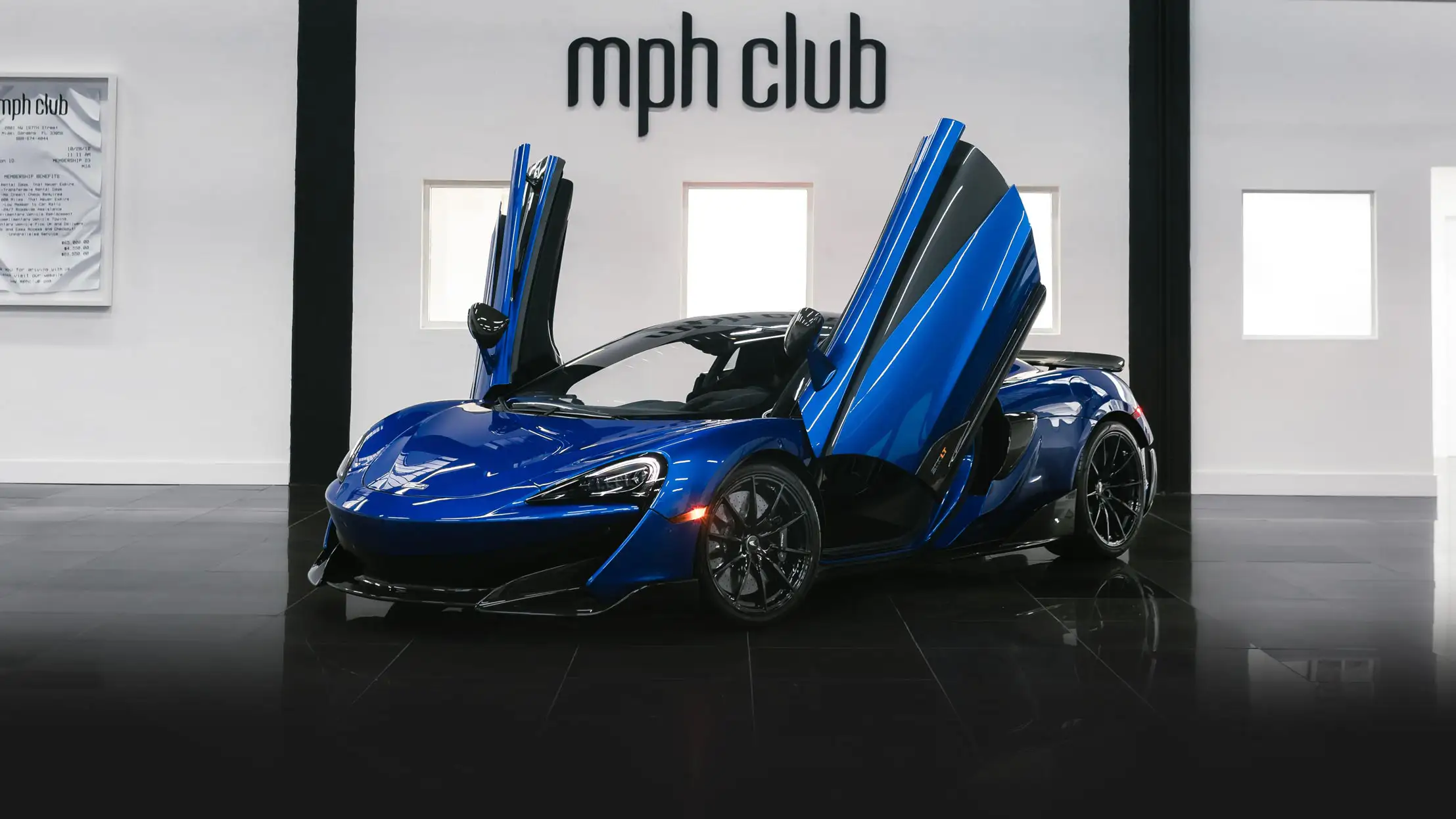 Blue McLaren 600lt rental profile view mph club