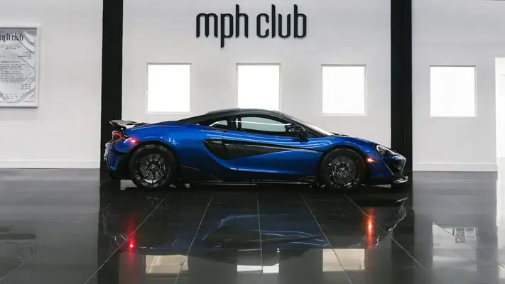 Blue McLaren 600lt rental side view mph club