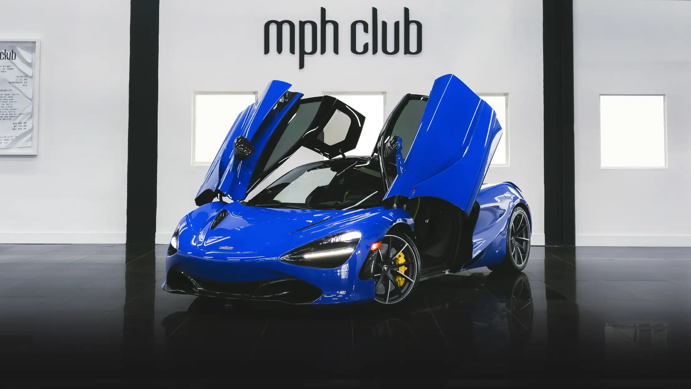 Blue McLaren 720s rental profile view mph club