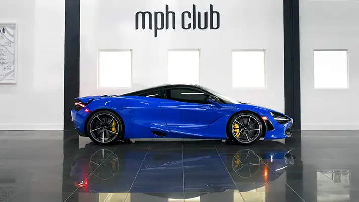 Blue McLaren 720s rental side view mph club