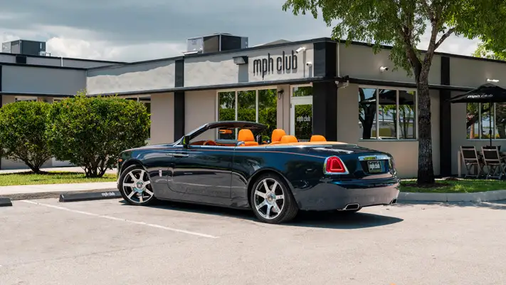 Blue Rolls Royce Dawn rental rear view mph club