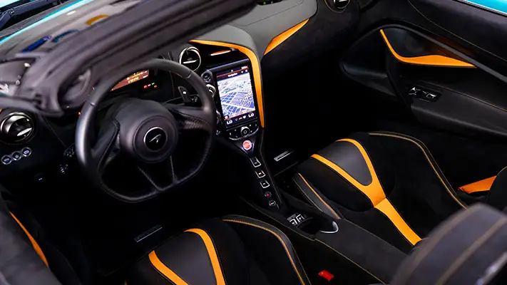 Cyan McLaren 720s Spider rental dashboard view mph club