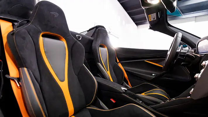 Cyan McLaren 720s Spider rental interior view mph club