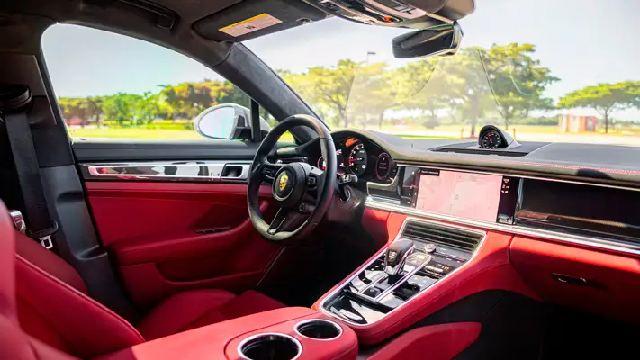 Grey Porsche Panamera GTS rental Miami dashboard view mph club