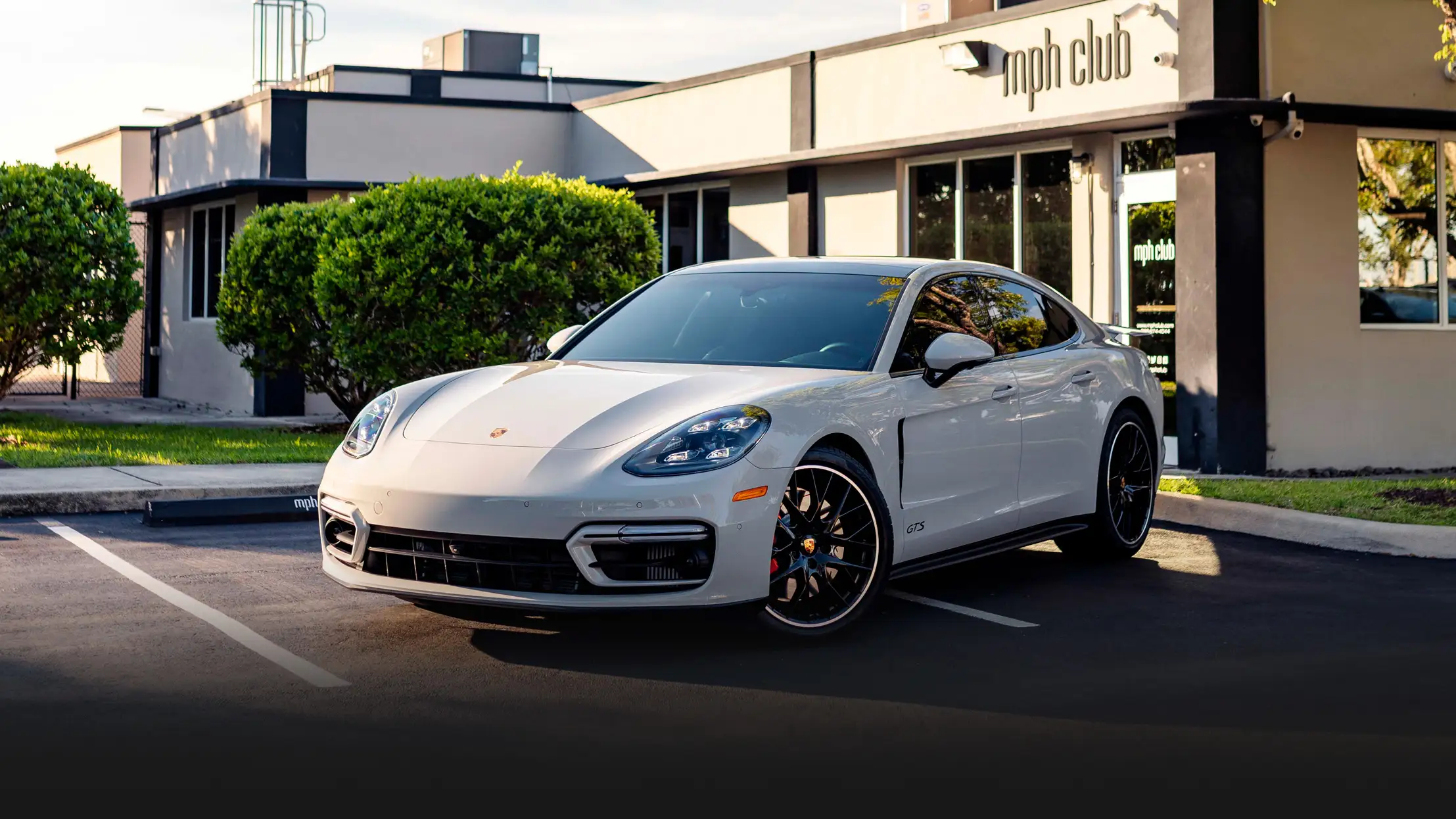 Grey Porsche Panamera GTS rental Miami profile view mph club