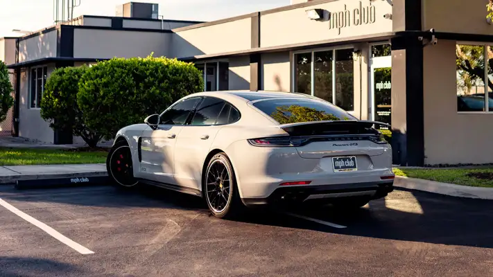 Grey Porsche Panamera GTS rental Miami rear view mph club