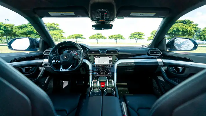Lite blue Lamborghini Urus rental interior view mph club