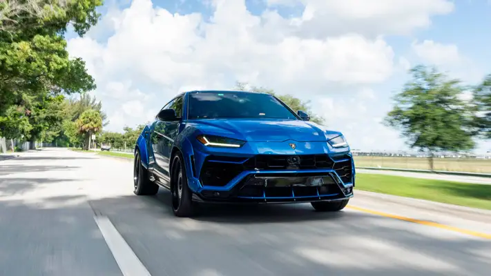 Lite blue Lamborghini Urus rental roller view mph club