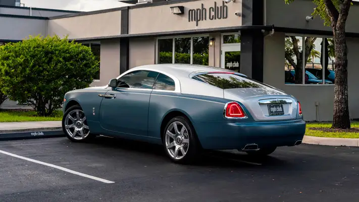 Matte blue Rolls Royce Wraith rental rear view mph club