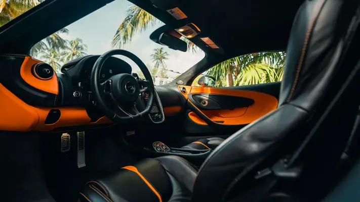 Orange McLaren 570s rental interior view mph club