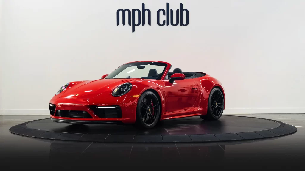 Red Porsche 911 Carrera Cabriolet rental profile view mph club