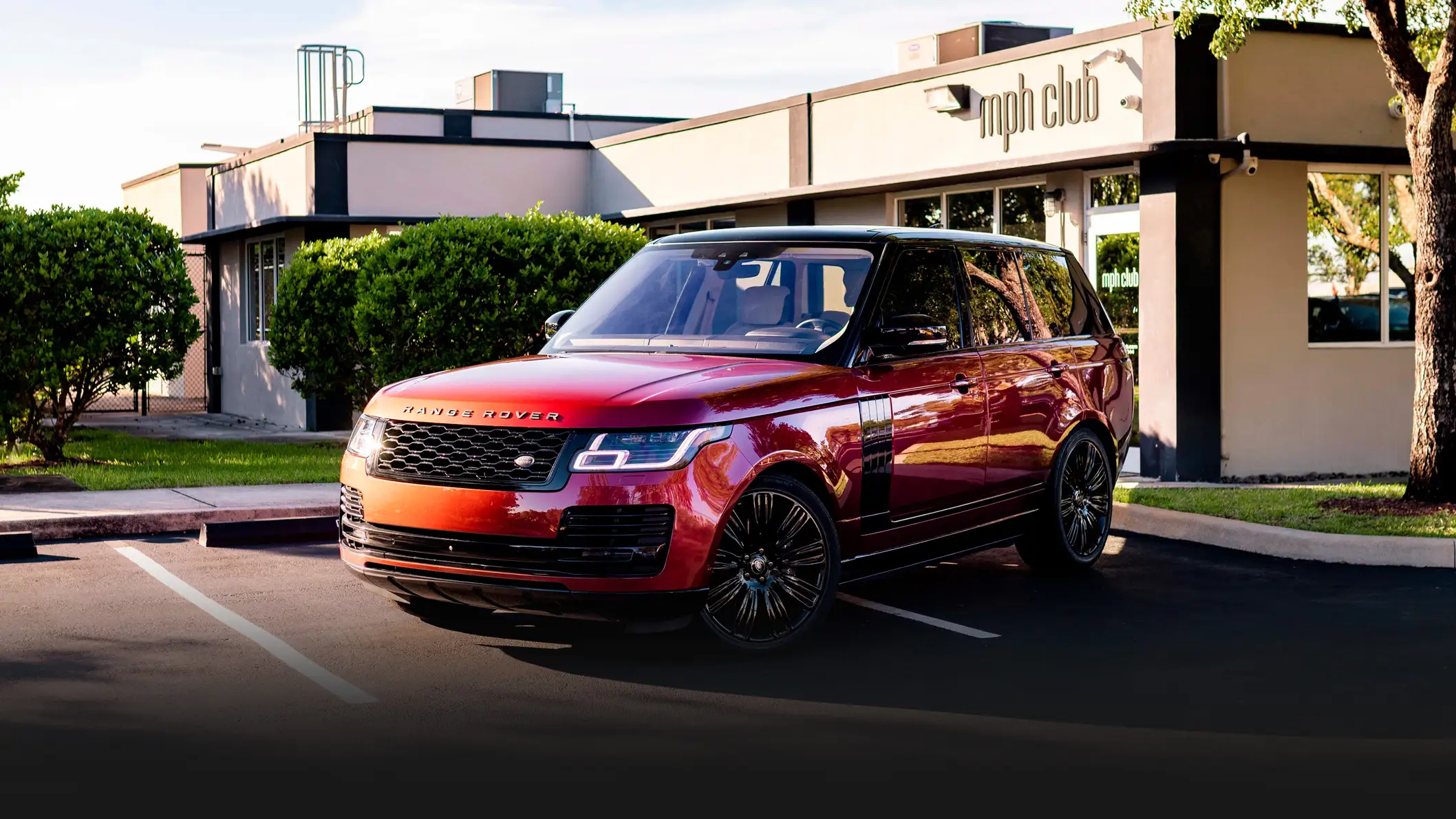 Red Range Rover rental Miami profile view mph club