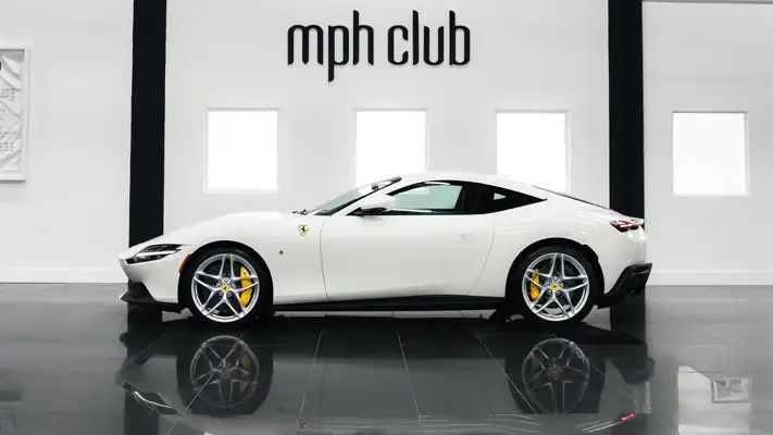 White Ferrari Roma rental Miami side view mph club