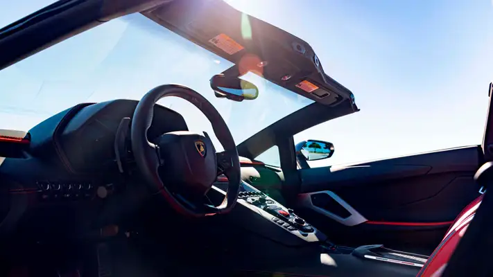 White Lamborghini Aventador S Roadster for rent Miami dashboard view mph club