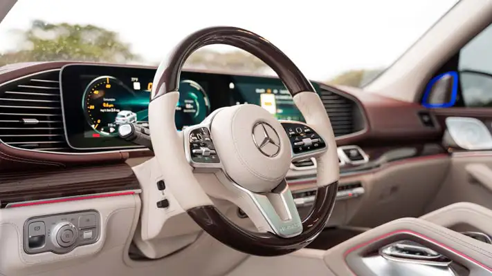 White Mercedes Maybach SUV rental dashboard view mph club
