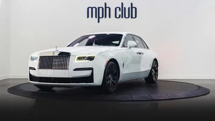 White on blue Rolls Royce Ghost profile view rental rszd mph club