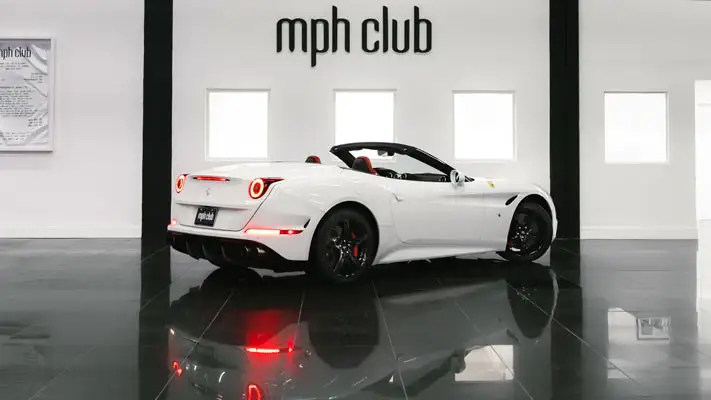 White on red Ferrari California T rental rear view mph club