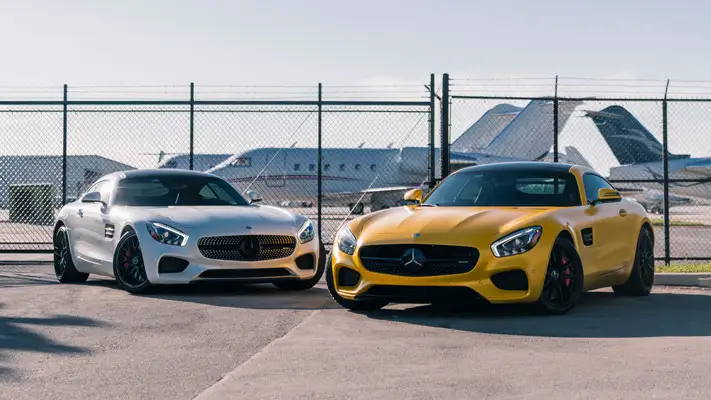 Yellow and white Mercedes Benz AMG GTS rental mph club