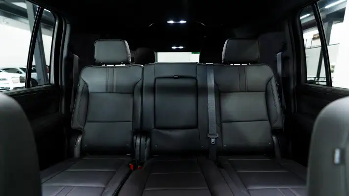 Black on black Chevrolet Suburban rental interior view mph club