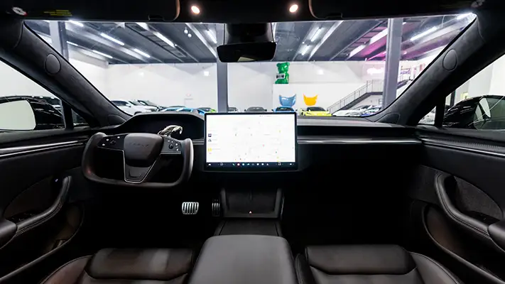 Black Tesla Model S Plaid rental dashboard view mph club