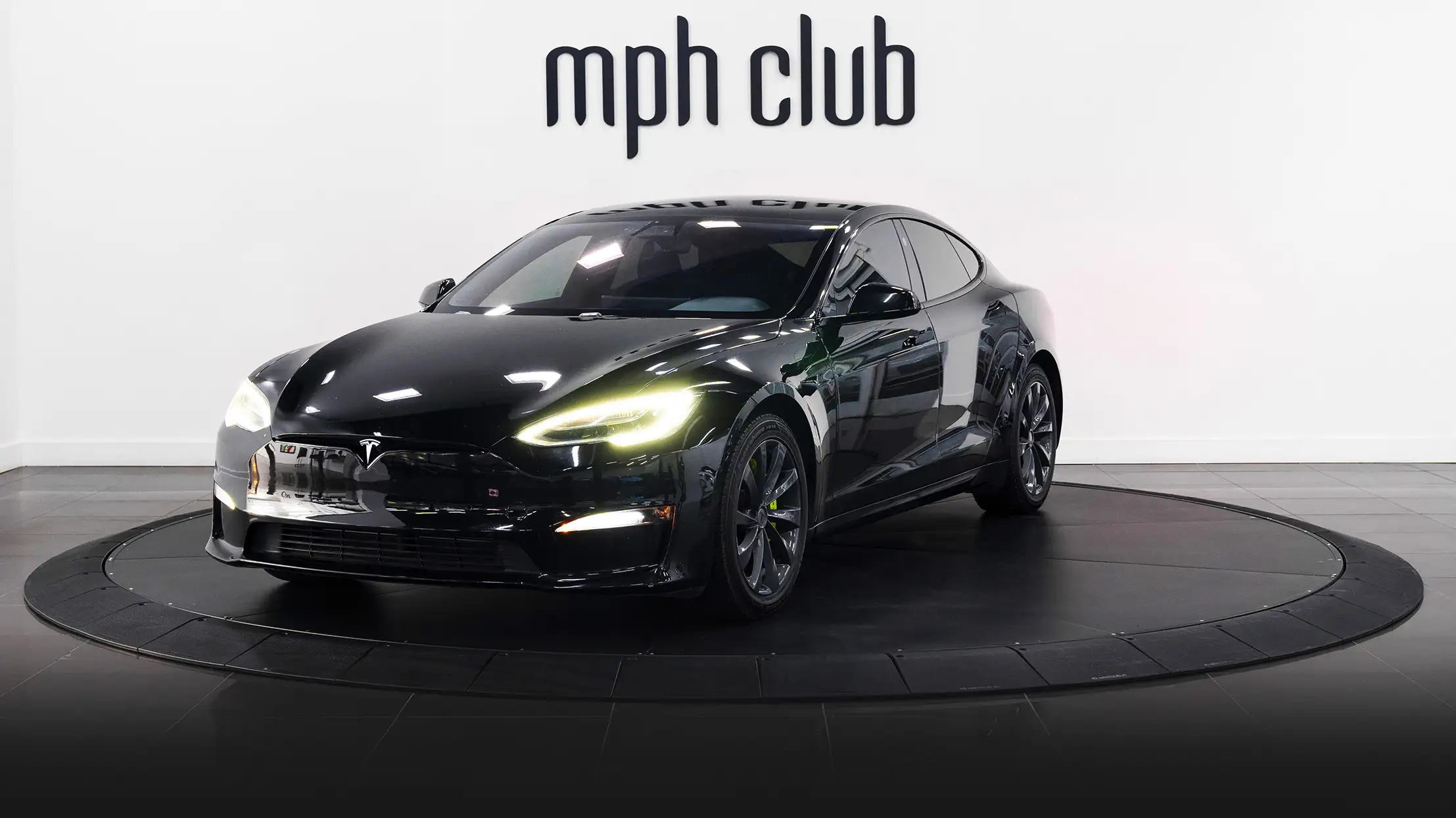 Black Tesla Model S Plaid rental profile view mph club