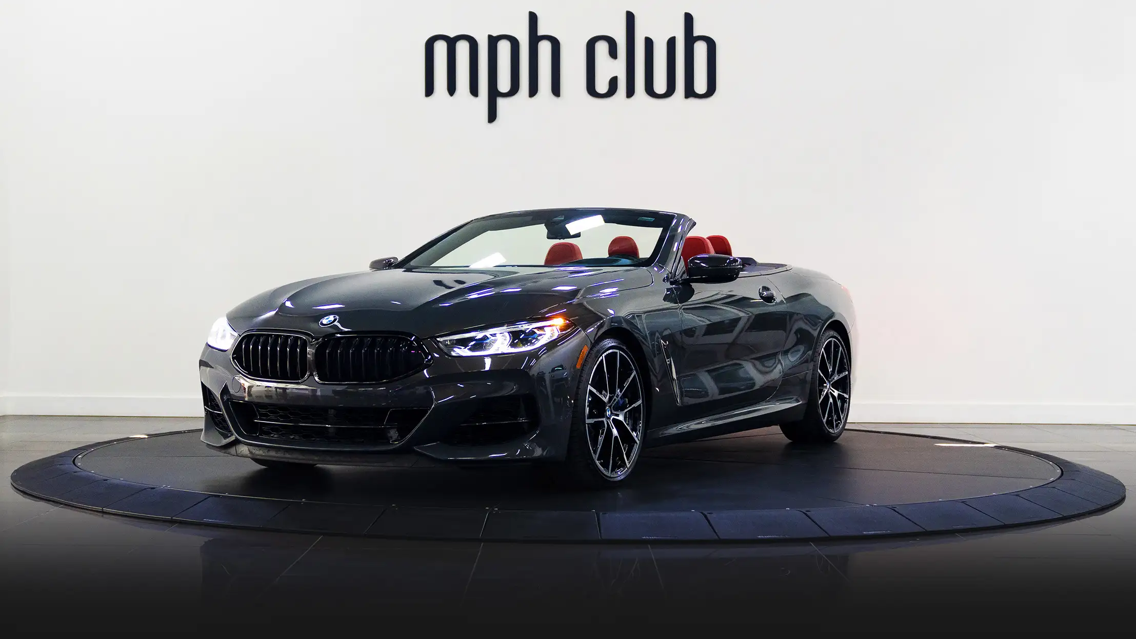 Grey BMW 850I rental profile view mph club