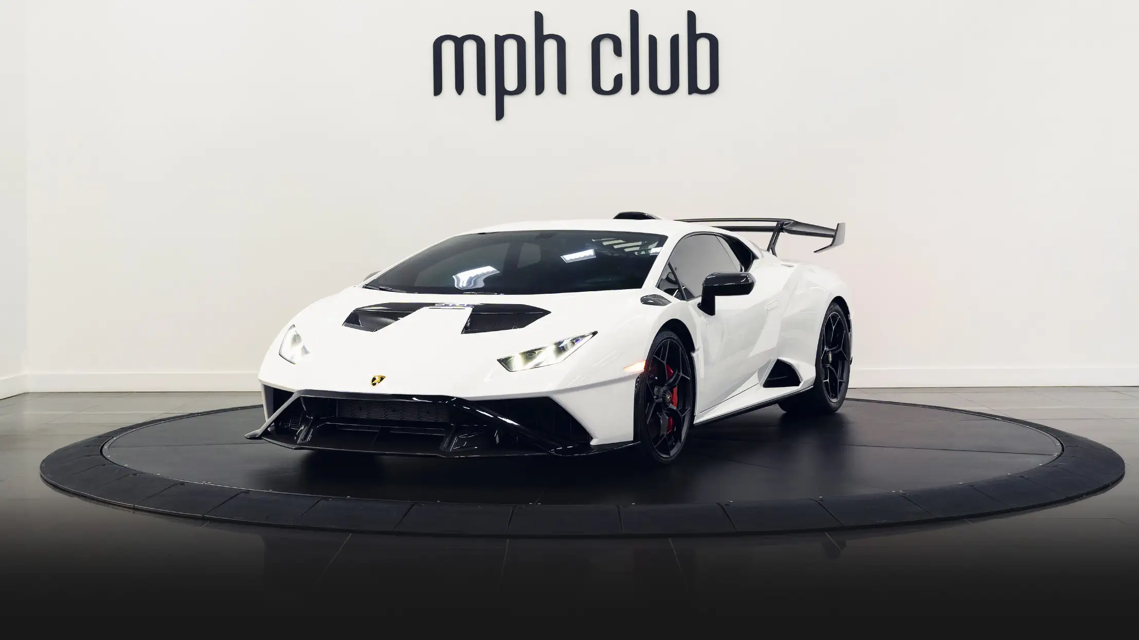 Lamborghini Huracan STO rental Miami profile view mph club