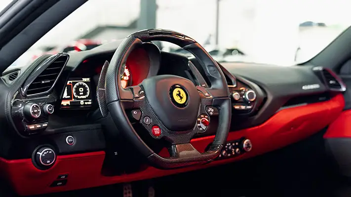 White Ferrari 488 GTB rental dashboard view mph club