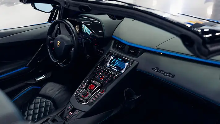 Blue on black Lamborghini Aventador S Roadster for rent dashboard view turntable mph club