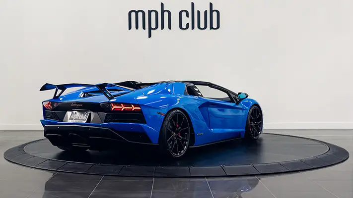 Blue on black Lamborghini Aventador S Roadster for rent rear view turntable mph club