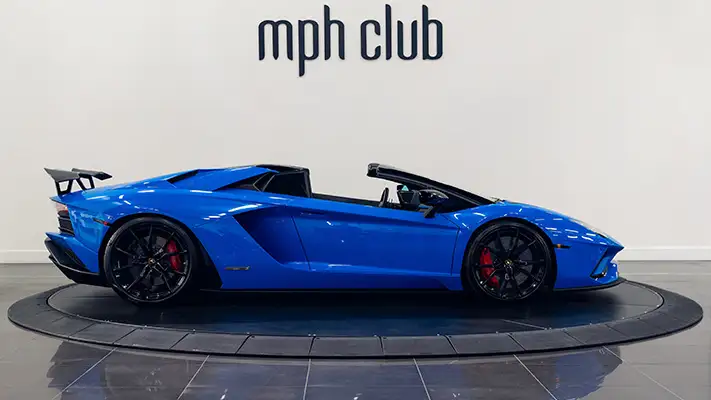 Blue on black Lamborghini Aventador S Roadster for rent side view turntable mph club