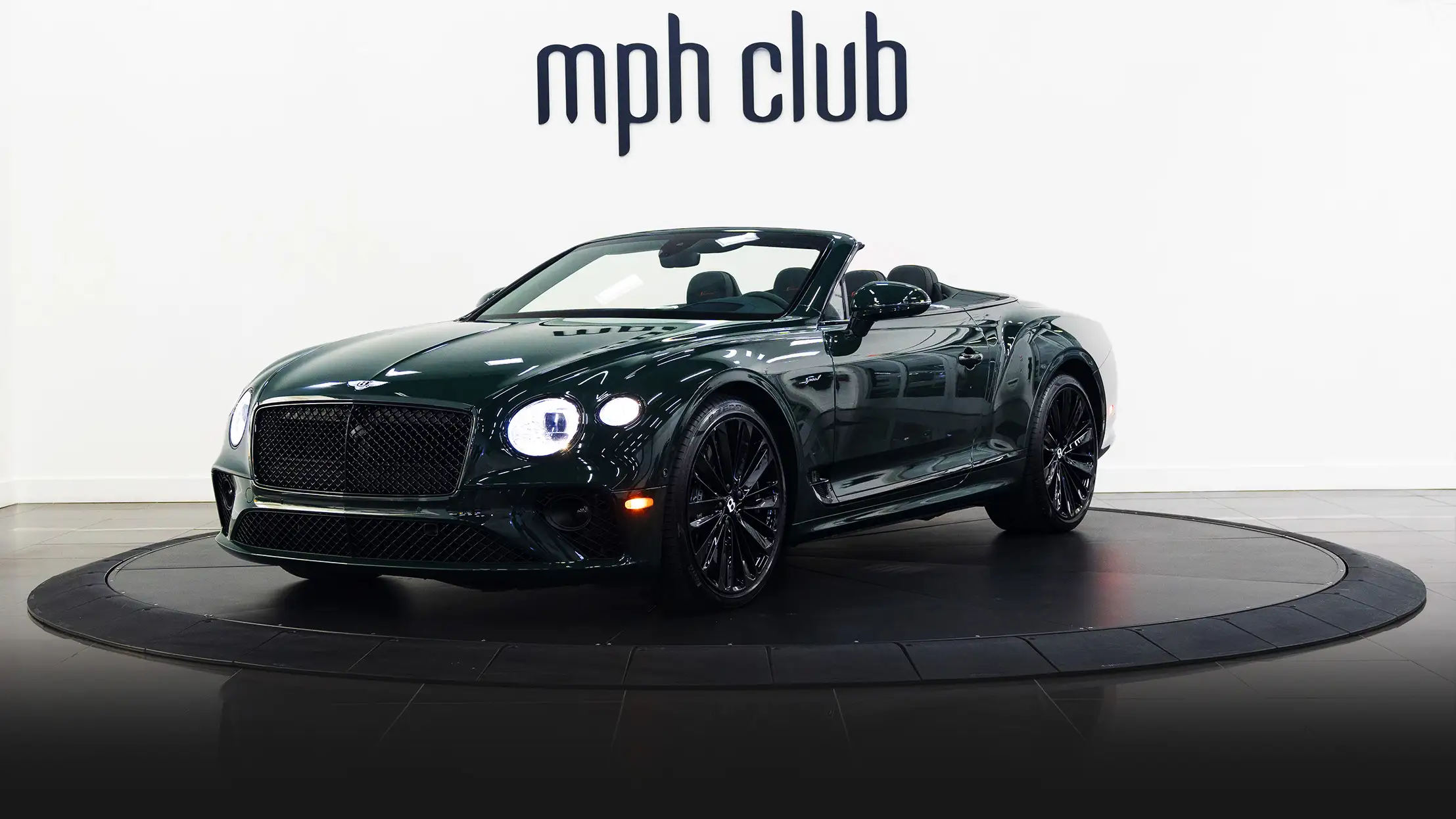 Green Bentley Continental GTC Speed rental profile view mph club