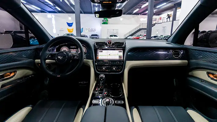 White Bentley Bentayga rental Miami dashboard view mph club