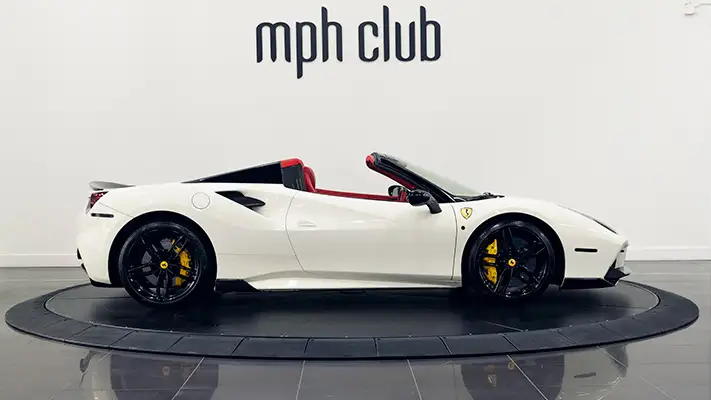 White on red Ferrari 488 Spider for rent side view mph club