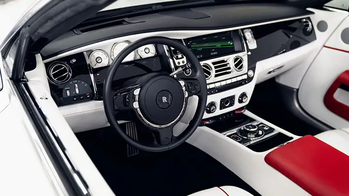 White on white Rolls Royce Dawn rental dashboard view mph club