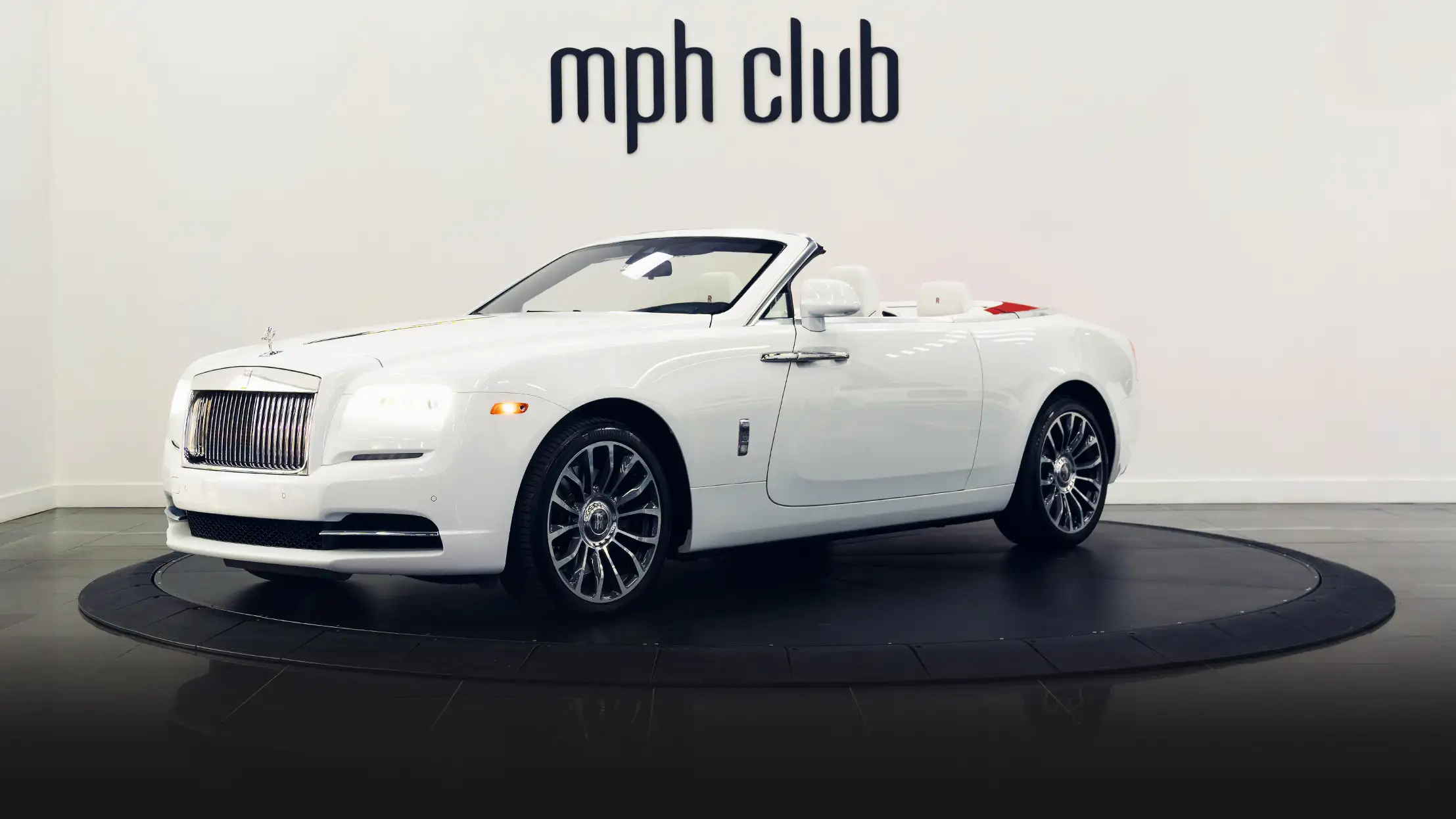 White on white Rolls Royce Dawn rental profile view mph club