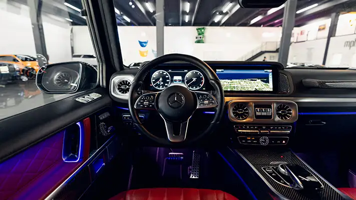 Black on red Mercedes Benz G550 rental dashboard view turntable mph club