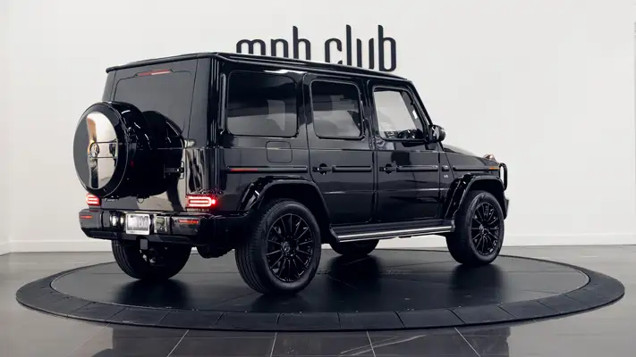 Black on red Mercedes Benz G550 rental rear view turntable mph club