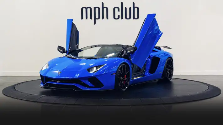 Blue on black Lamborghini Aventador S Roadster for rent profile view doors open turntable rszd - mph club