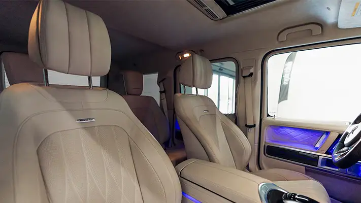 Sand with white interior Mercedes Benz G63 AMG G Wagon rental interior view turntable mph club