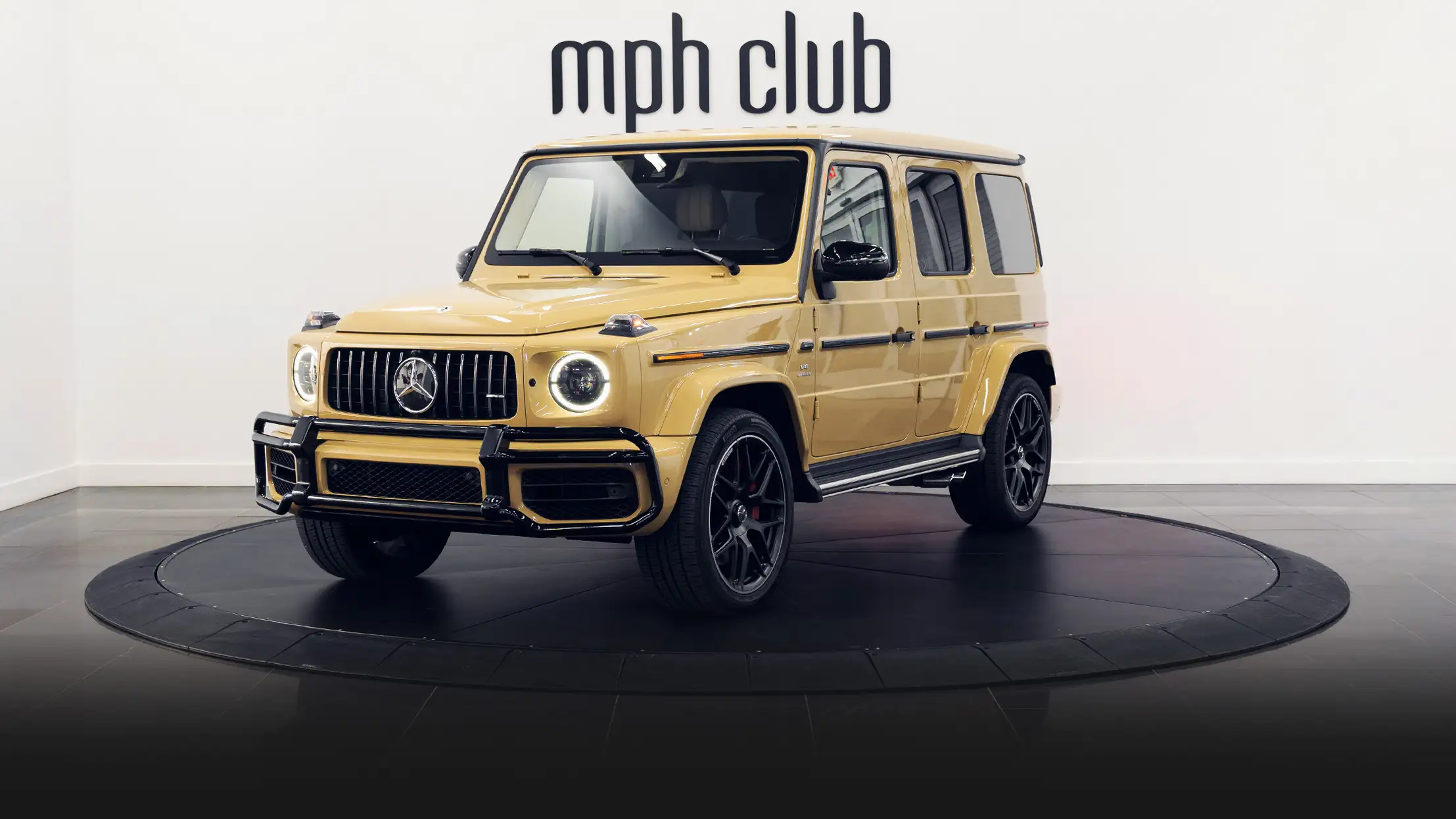 Sand with white interior Mercedes Benz G63 AMG G Wagon rental profile view turntable rszd mph club