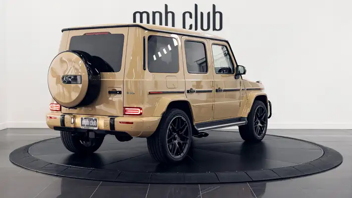 Sand with white interior Mercedes Benz G63 AMG G Wagon rental rear view turntable mph club